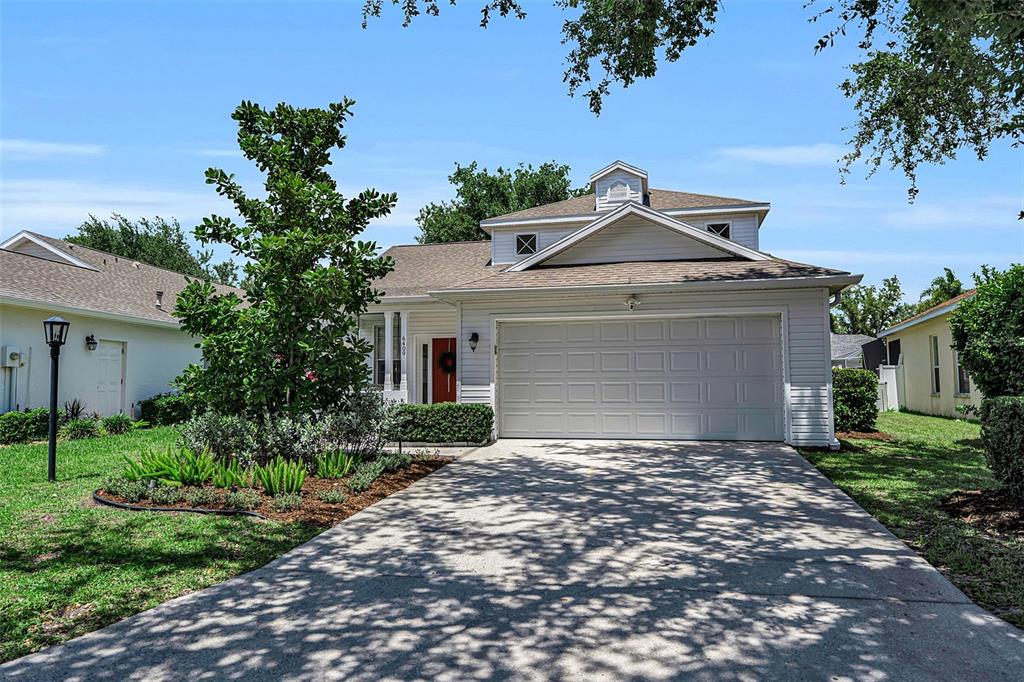 A Lakewood Ranch home with a red front door
